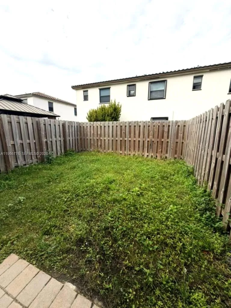 small backyard with fence