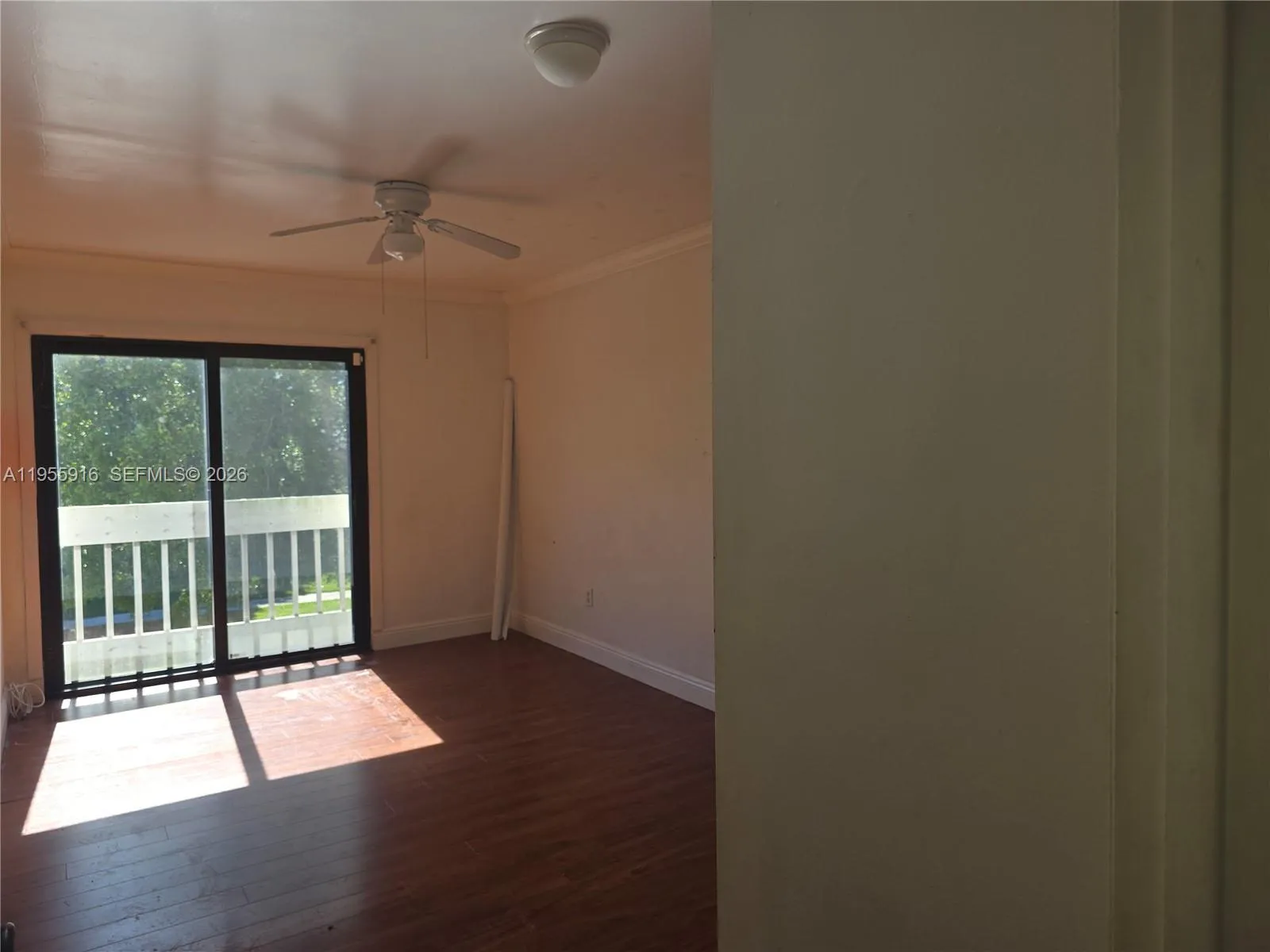 Second bedroom with impact sliding doors and closets.