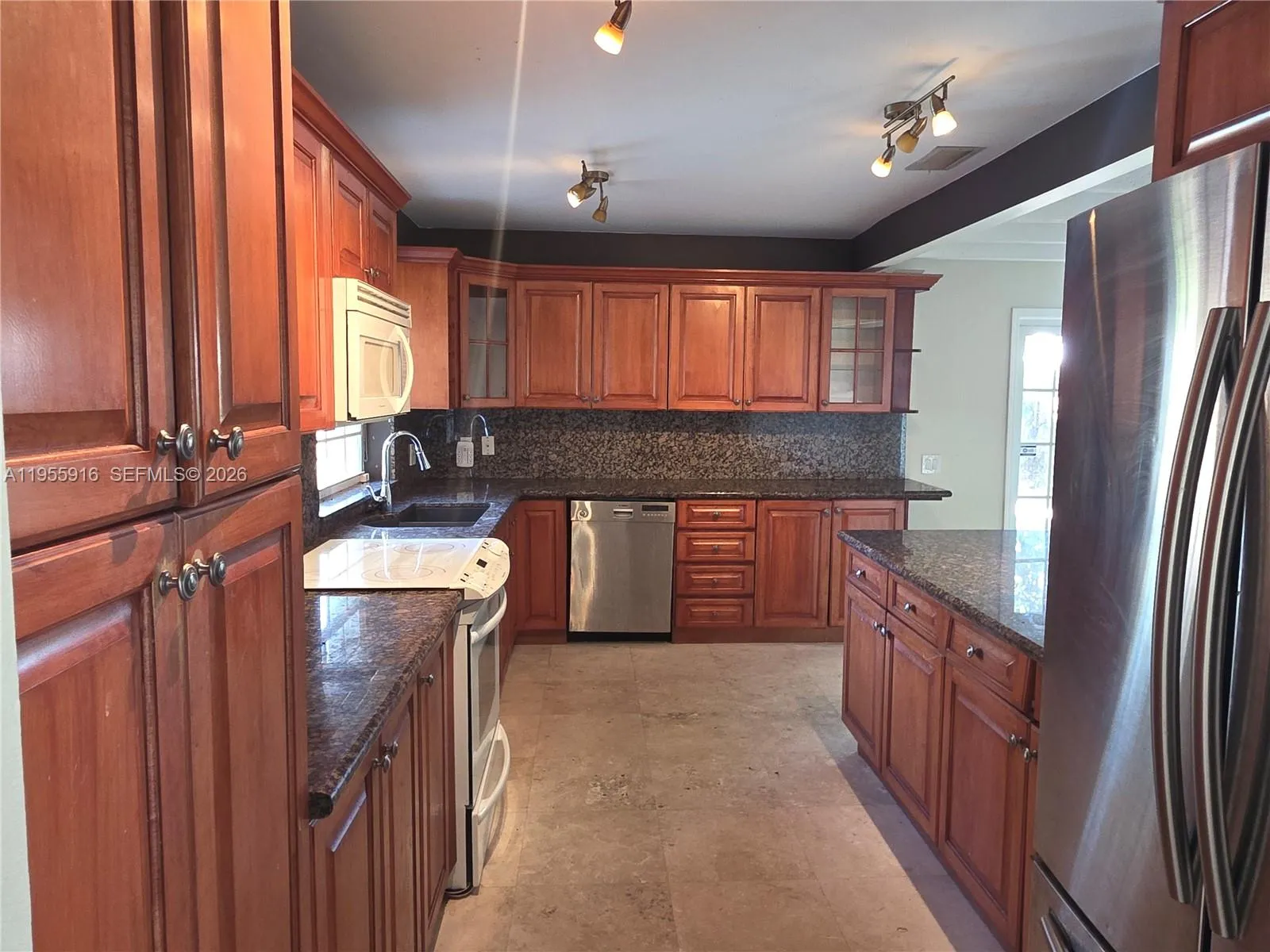 Large luminous kitchen with plenty of counter area.