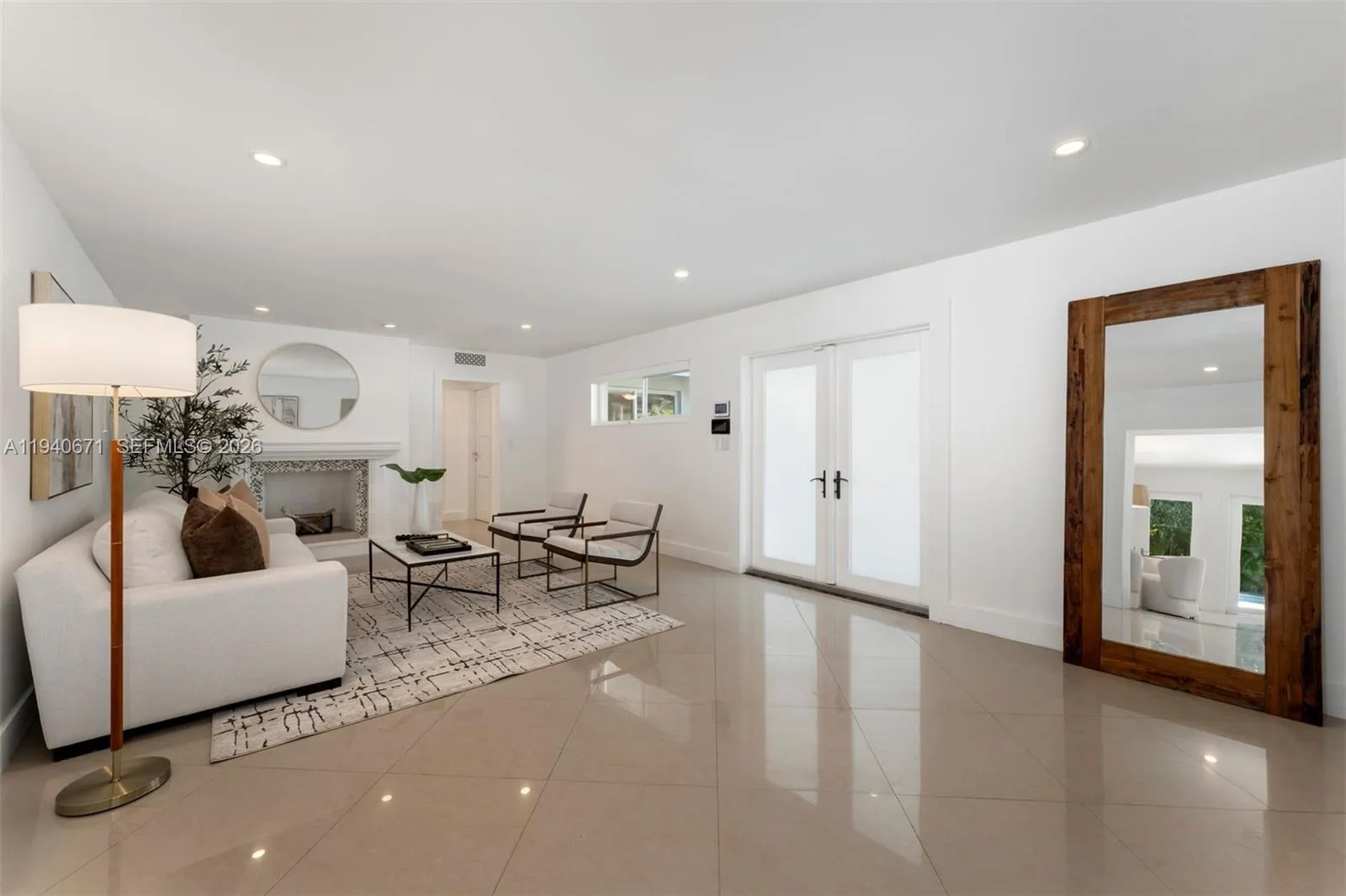 Foyer entry to living room with fireplace