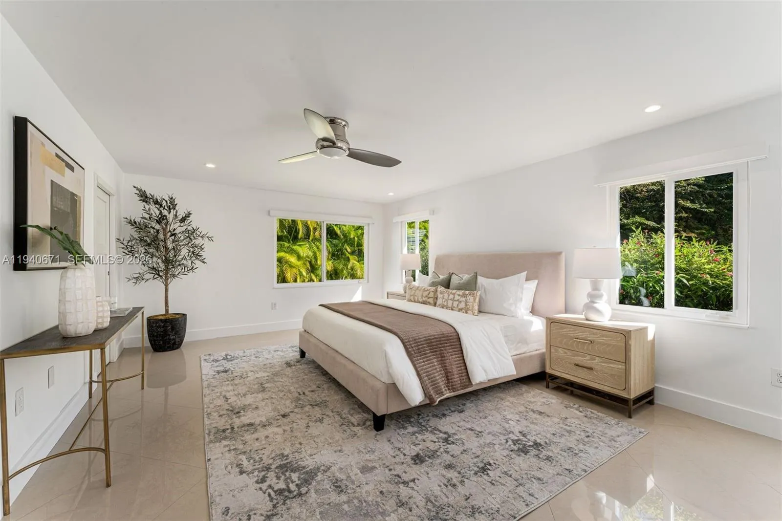 Primary bedroom with access to pool and patio