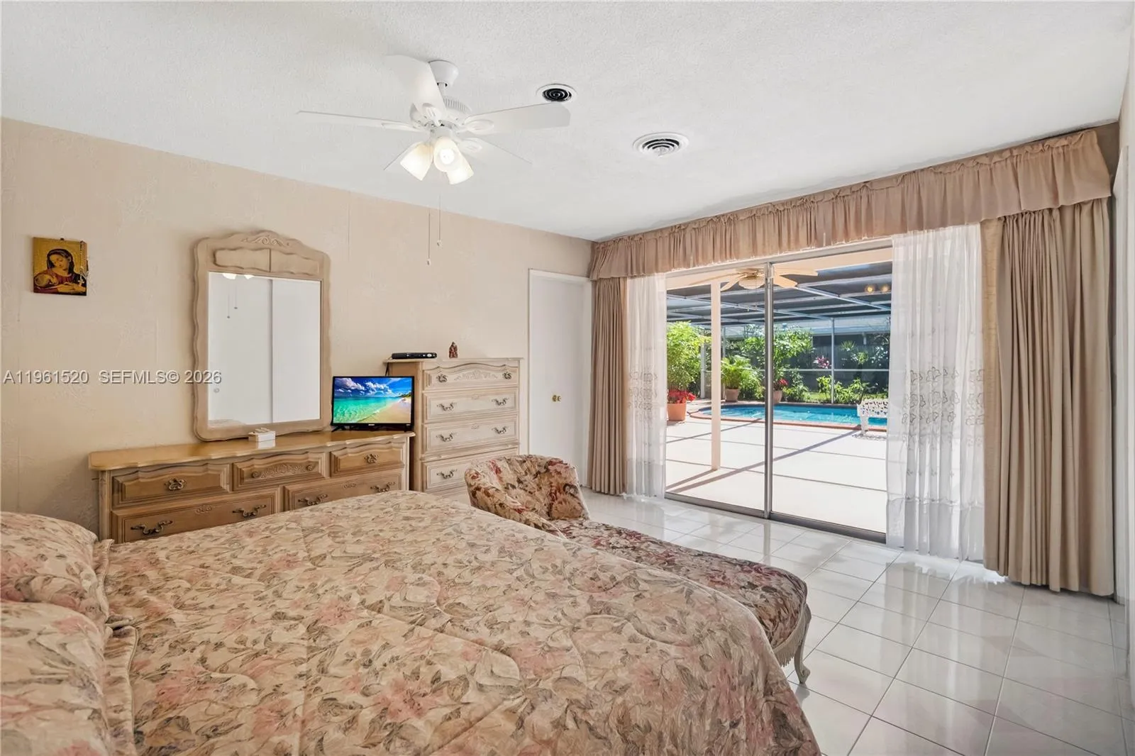 Large primary suite with direct access to pool/patio. Tons of Natural light!