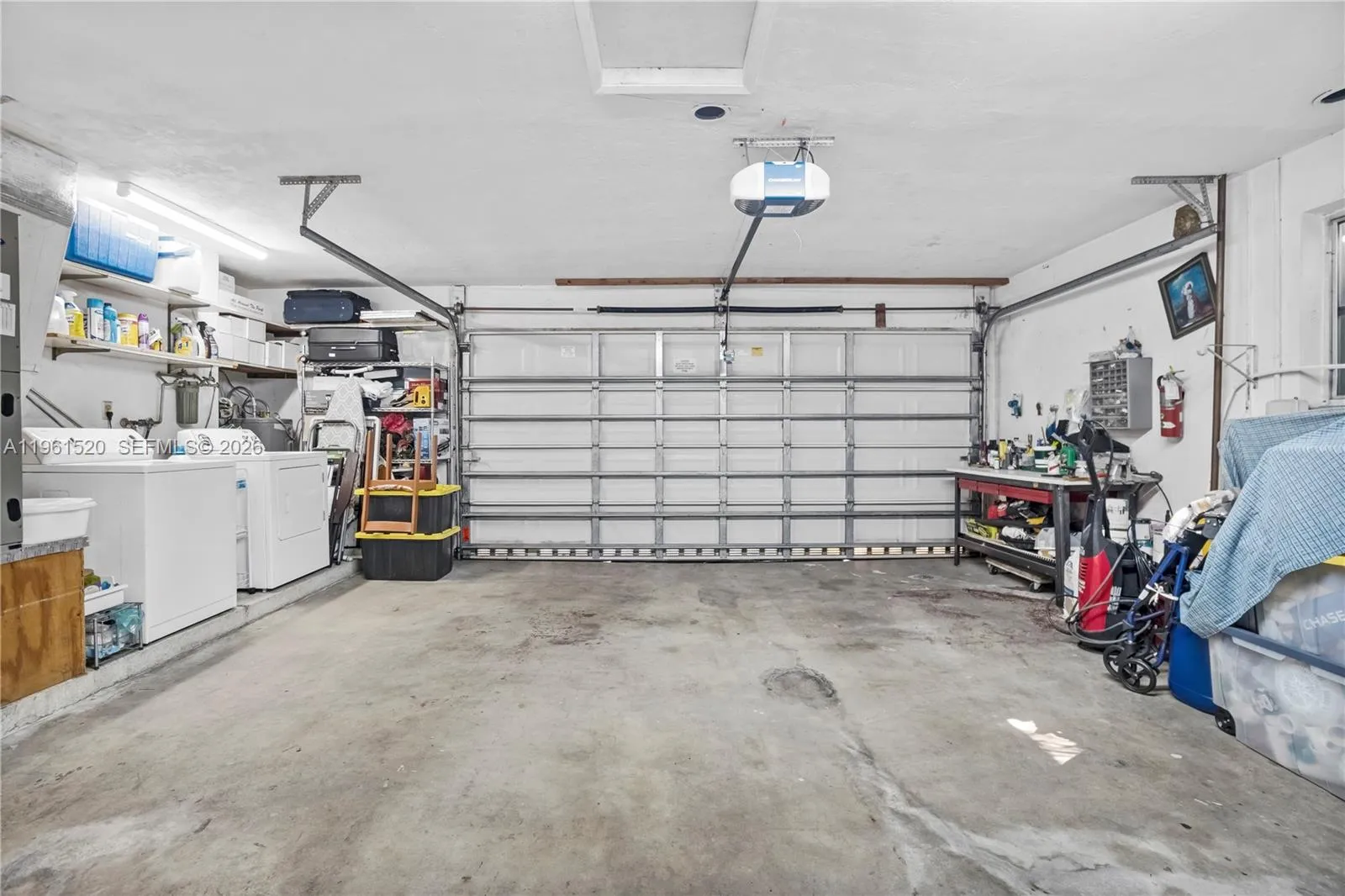 Large 2 car garage with workbench.