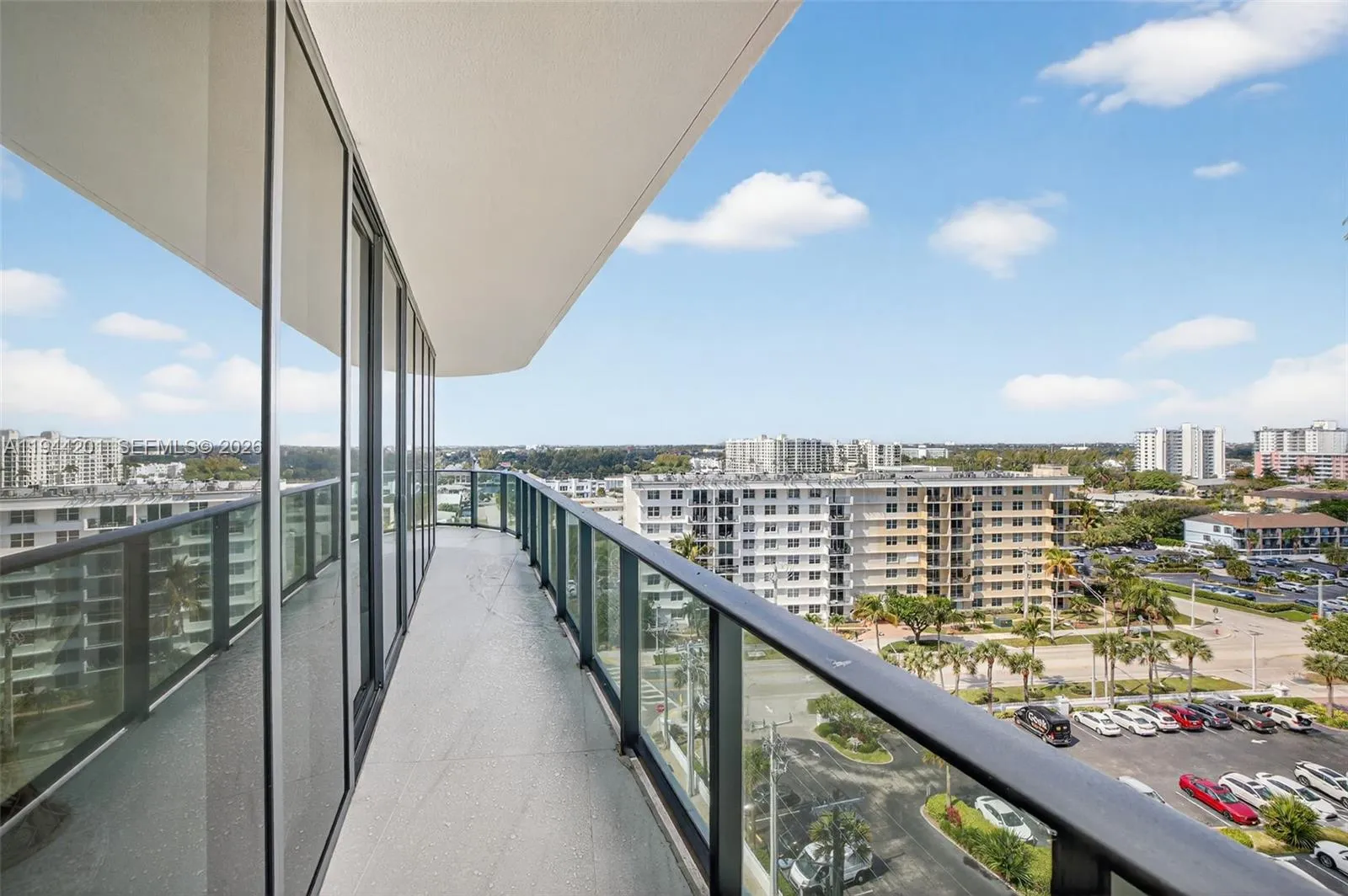 View toward the west from the North side balcony. Building in vacinity is being painted white.