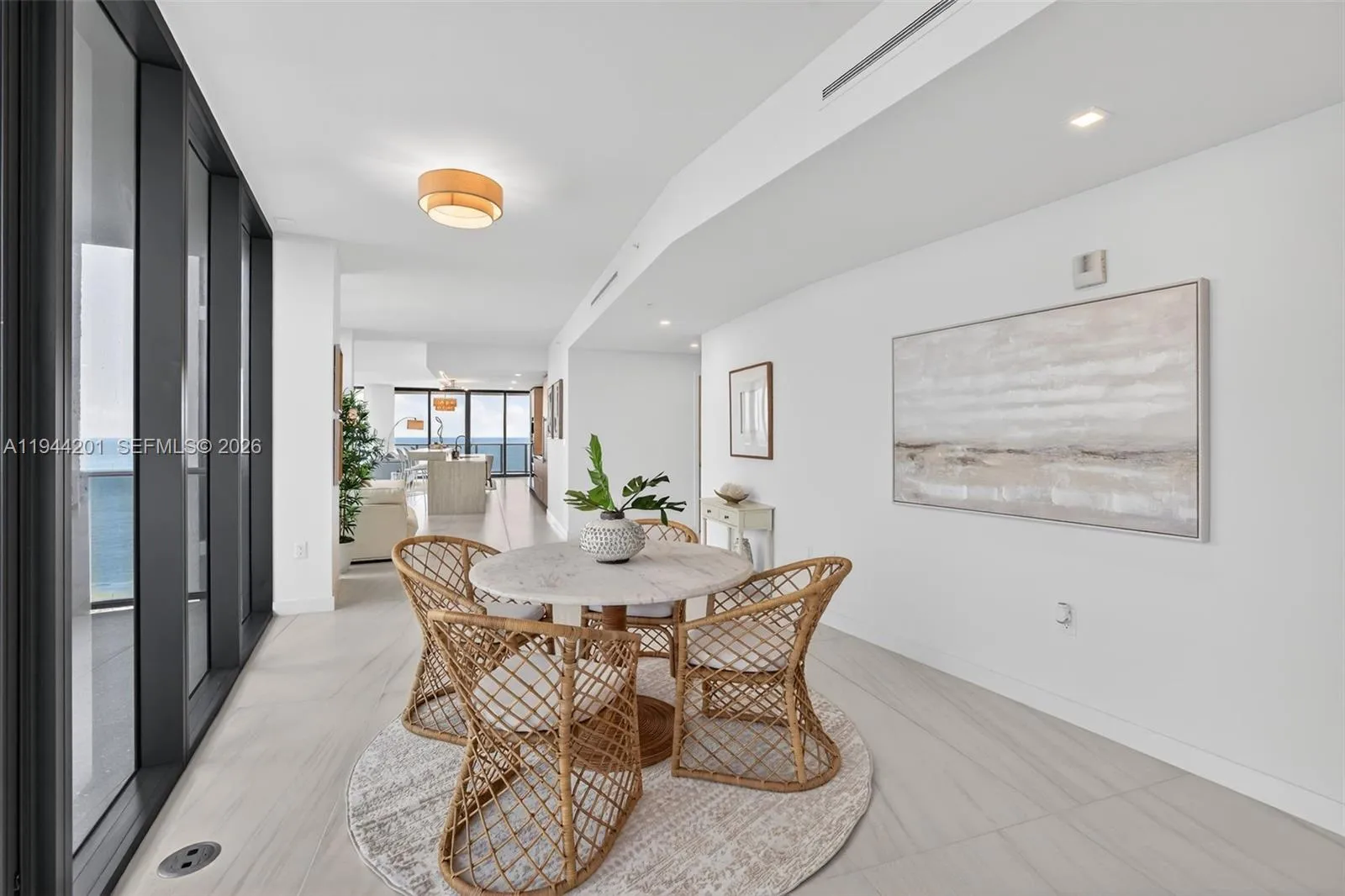 Open dining area with floor to ceiling glass, adjacent to chef’s kitchen and terrace for seamless indoor outdoor entertaining. This area is also a possible den / 4th bedroom as per the builders plans. Unit is a 4 bedroom per tax roll