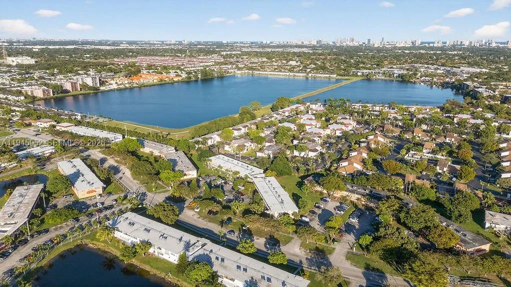 Aerial view of the building at 20311 NE 2nd Ave, Apt J15, located in a 55+ HOPA community in North Miami, with convenient access to major roads and nearby amenities.