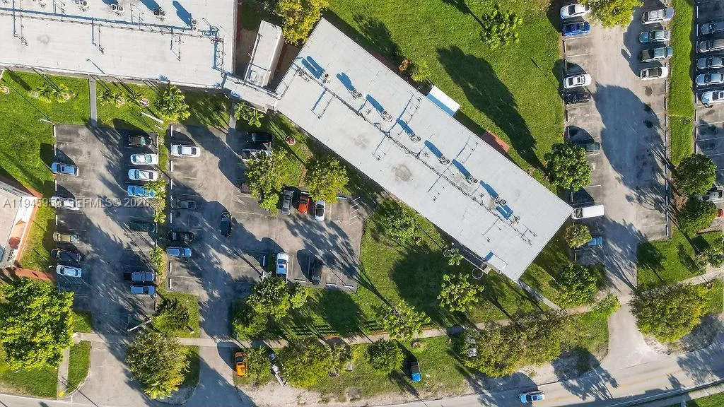 Aerial view of the building at 20311 NE 2nd Ave, Apt J15, located in a 55+ HOPA community in North Miami, with convenient access to major roads and nearby amenities.