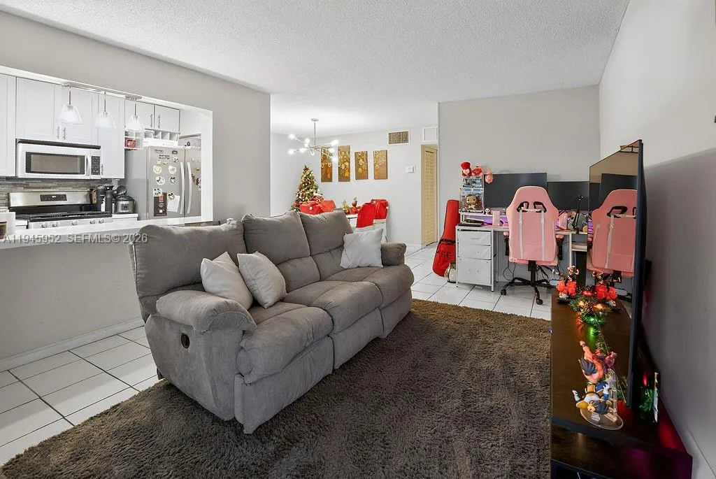 Living room featuring a functional layout with natural light and comfortable living space.