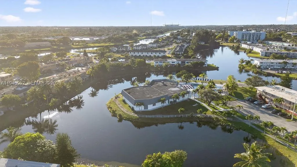Aerial view of the building at 20311 NE 2nd Ave, Apt J15, located in a 55+ HOPA community in North Miami, with convenient access to major roads and nearby amenities.