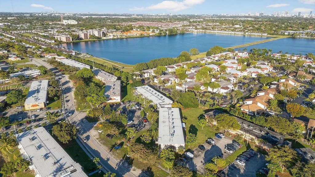 Aerial view of the building at 20311 NE 2nd Ave, Apt J15, located in a 55+ HOPA community in North Miami, with convenient access to major roads and nearby amenities.