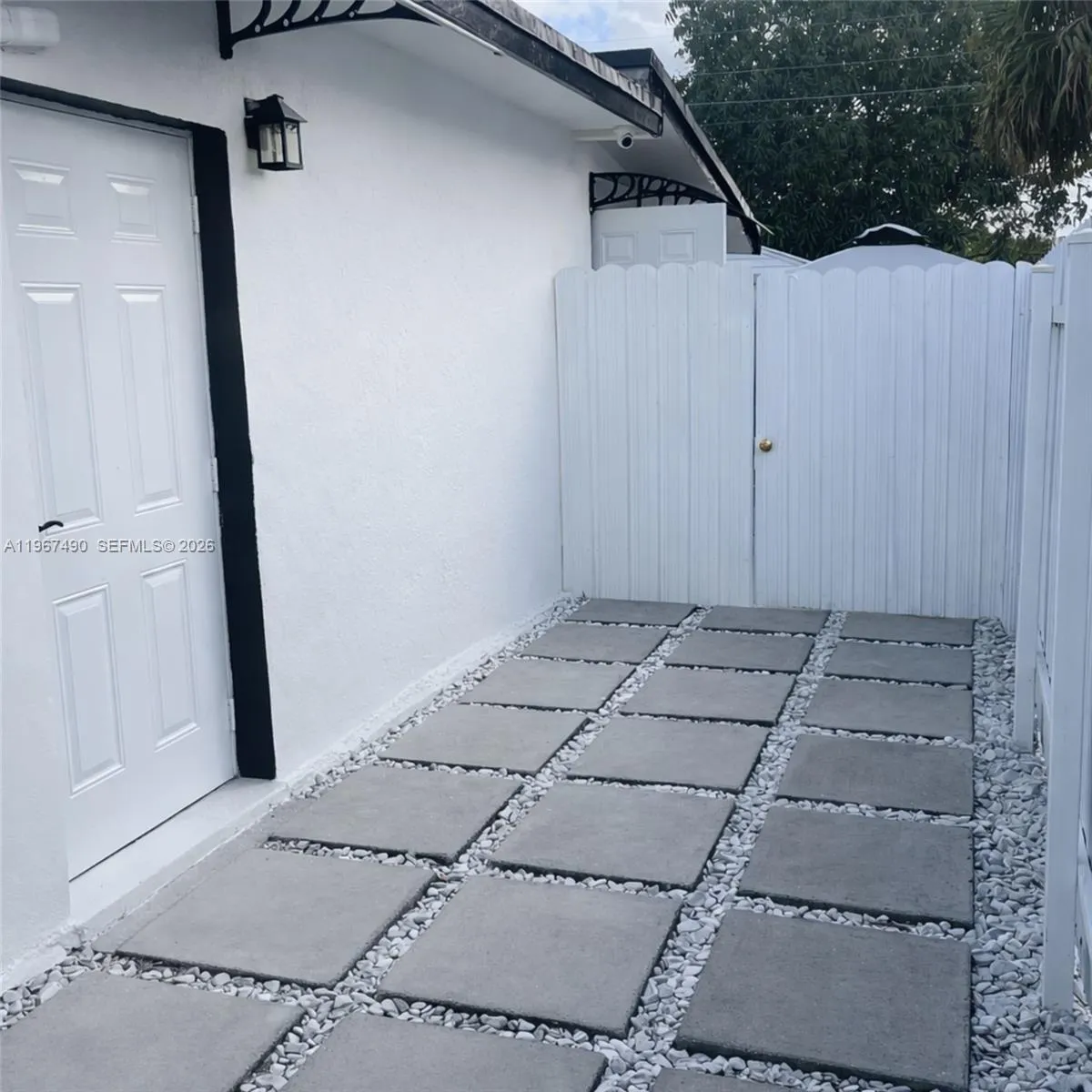 Fenced side patio with private access to the unit.