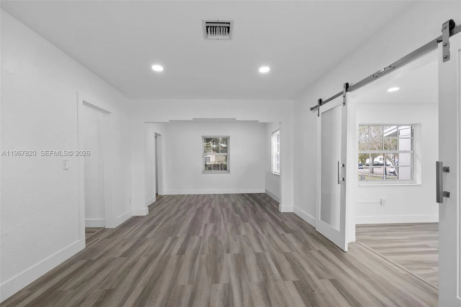 Living/Dining with Pocket Door to Den