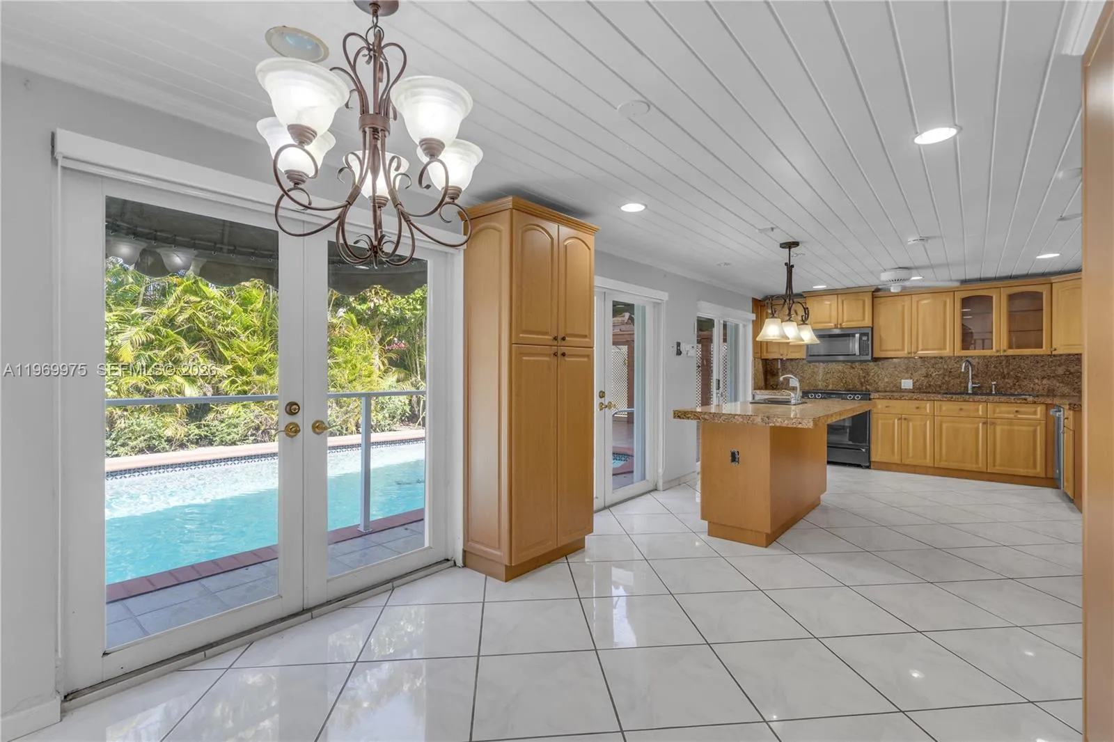 Abundant natural light throughout with multiple French doors.