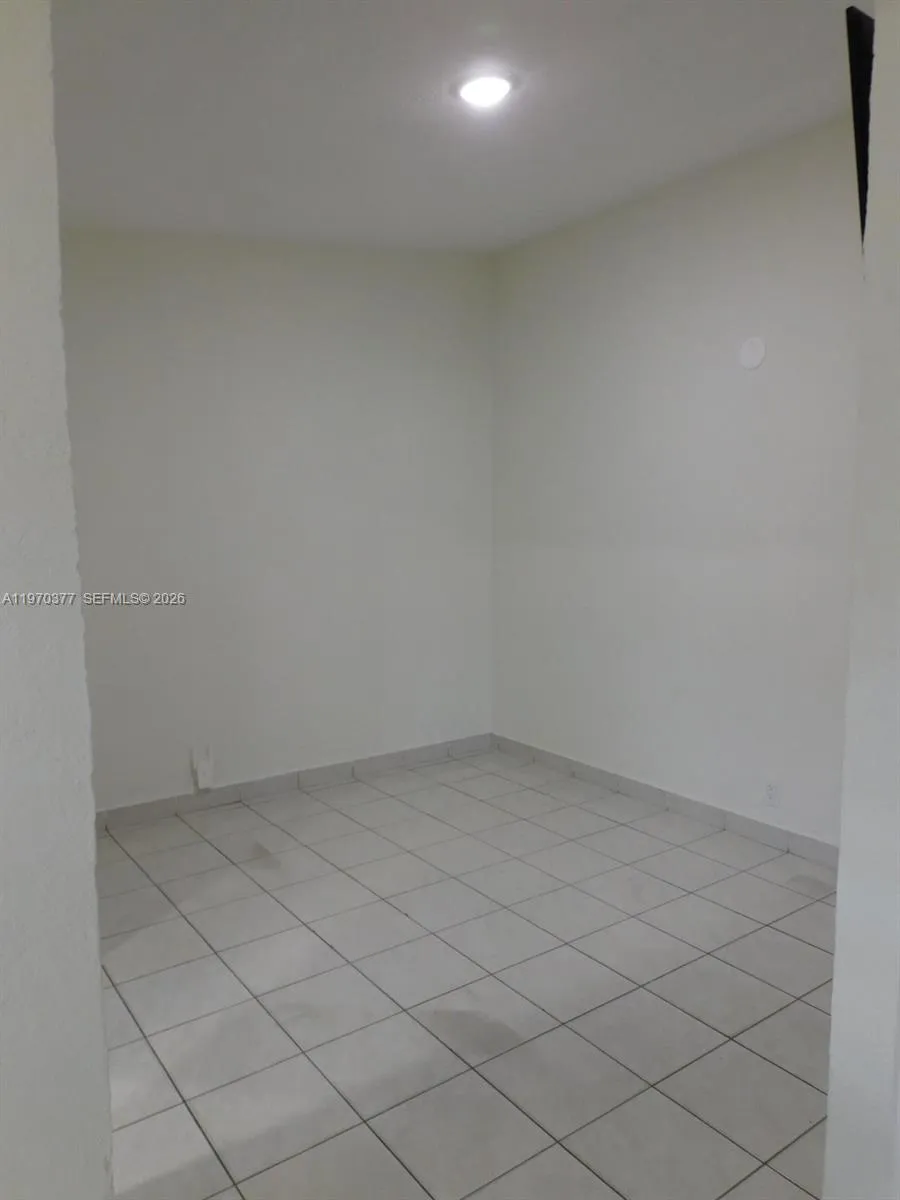 Primary bedroom offers an additional space ideal for a sitting area or office.