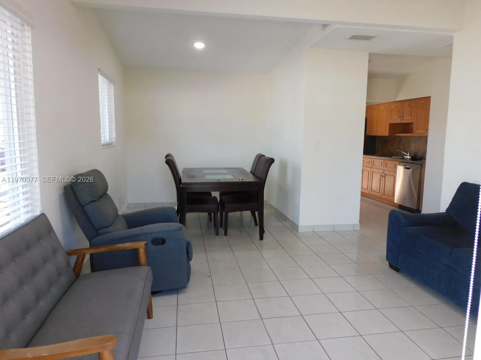 View from entrance to living and dining areas. All tiled for easy maintenance.