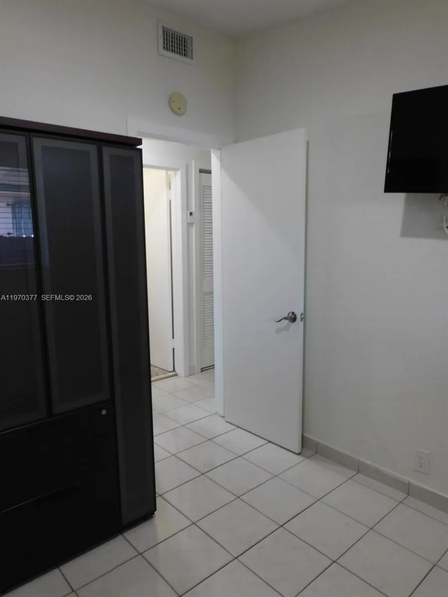 3rd bedroom view to entry door.
