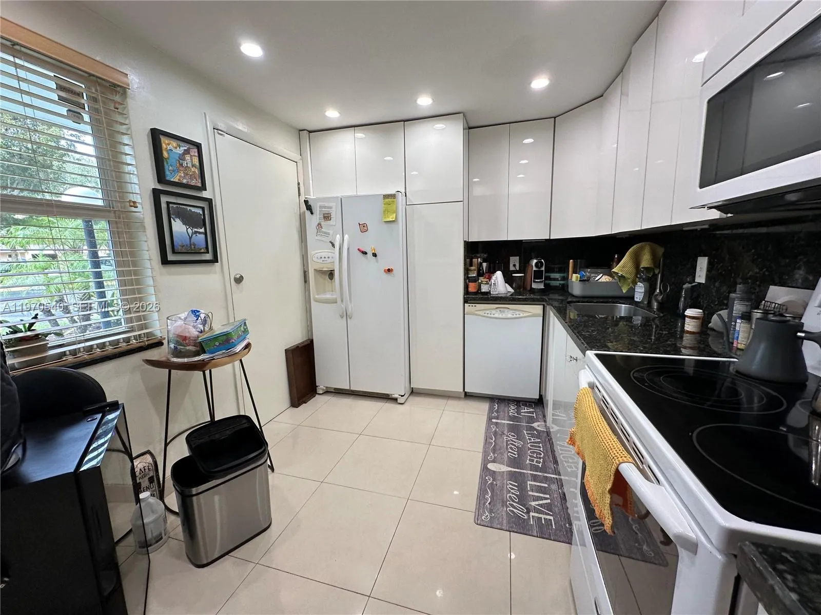 Remodeled kitchen with lacquered cabinets.