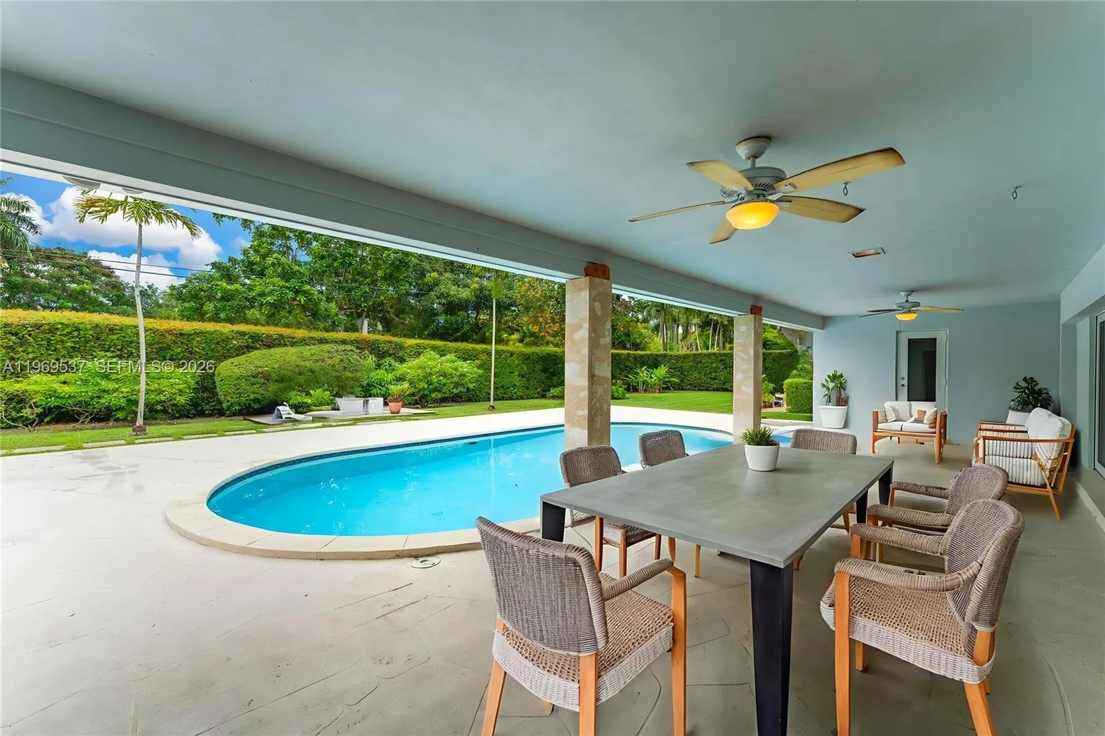 Covered patio overlooking the pool