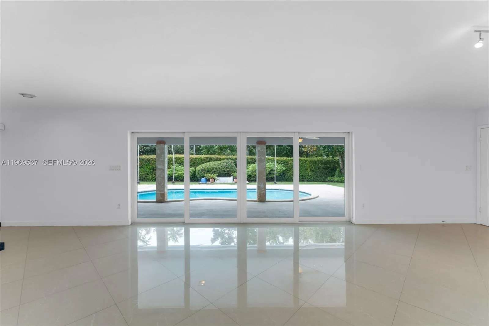 Beautiful view on the pool area from your living and dining area