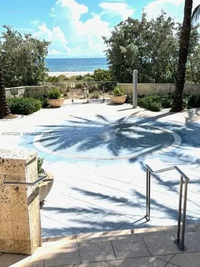 fountain to clean feet at the entrance from the beach