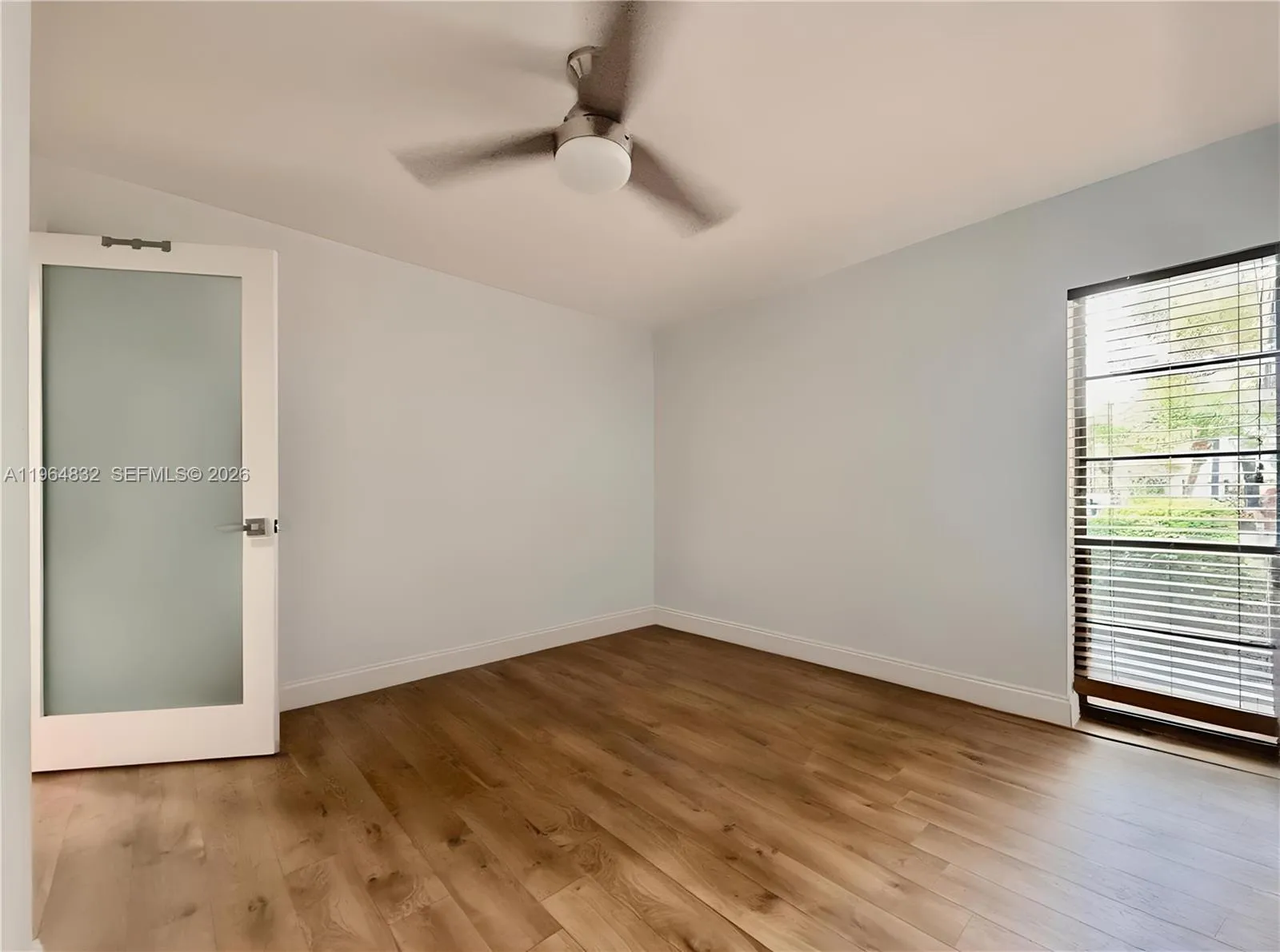 AI-adjusted image with furniture removed to highlight the room’s size and lines.