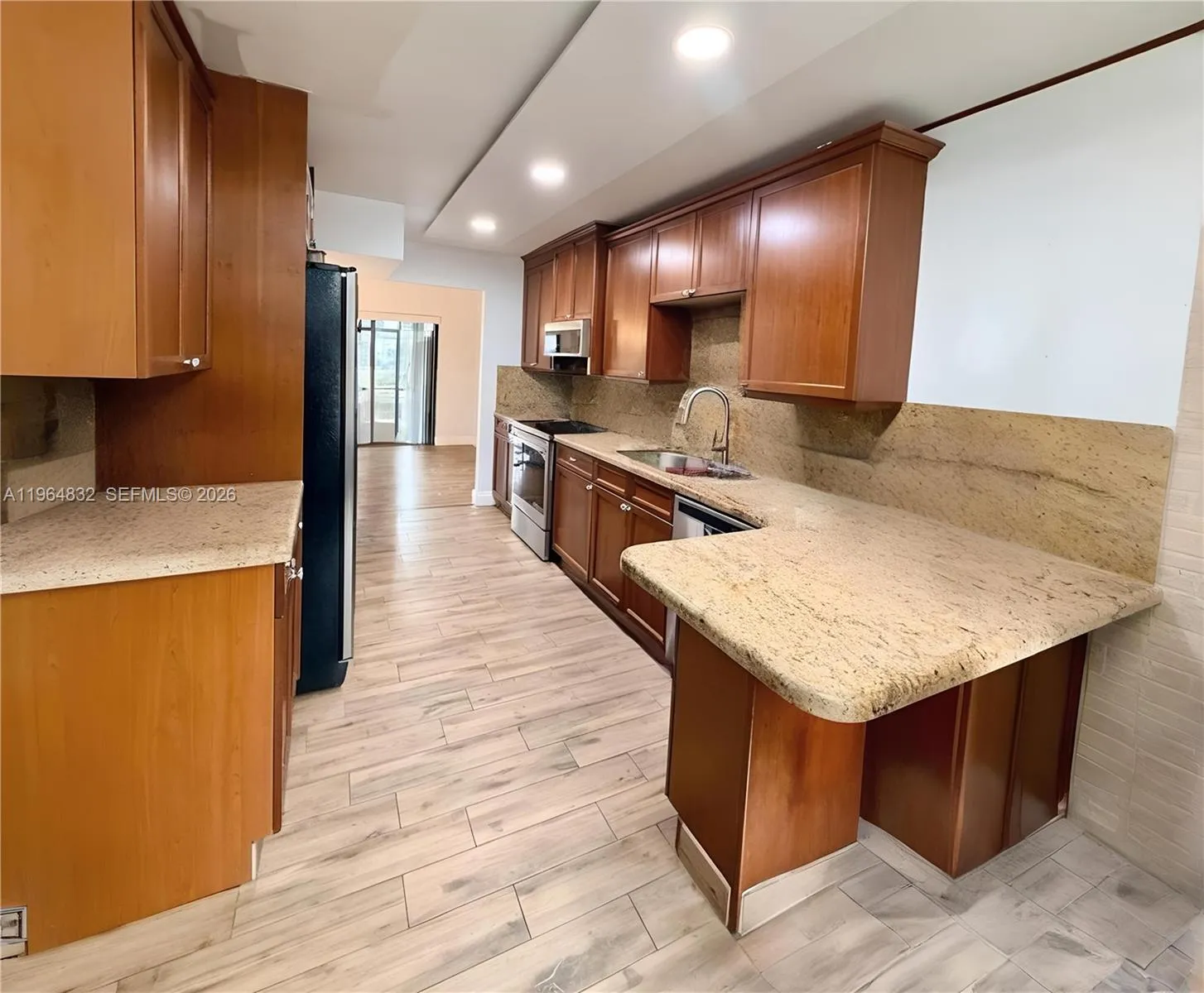 AI-adjusted image with furniture removed to highlight the room’s size and lines.