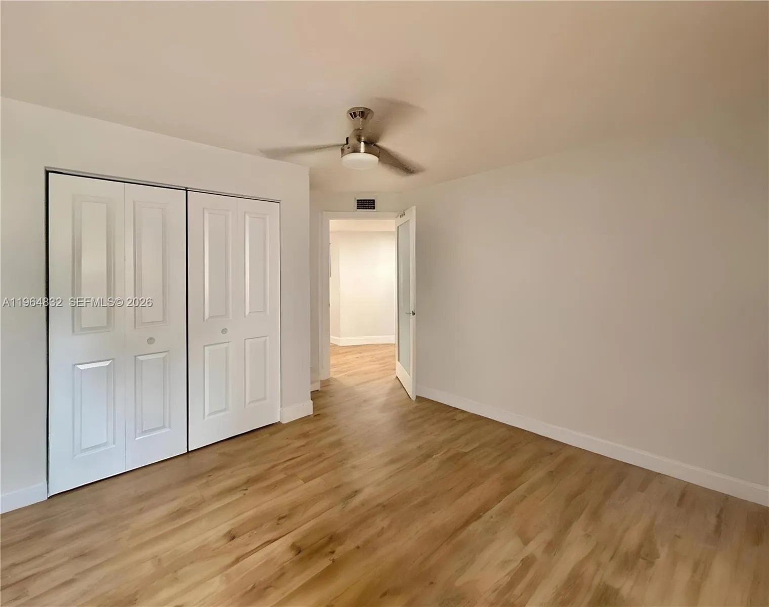 AI-adjusted image with furniture removed to highlight the room’s size and lines.