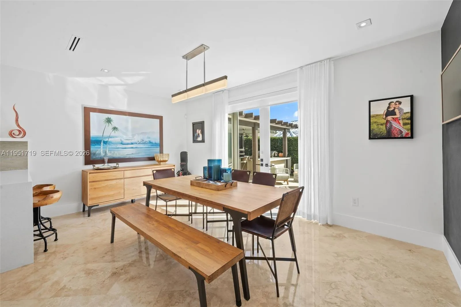 Wide quartz countertops and a high-performance peninsula offer ample prep space and a convenient breakfast bar for casual dining.