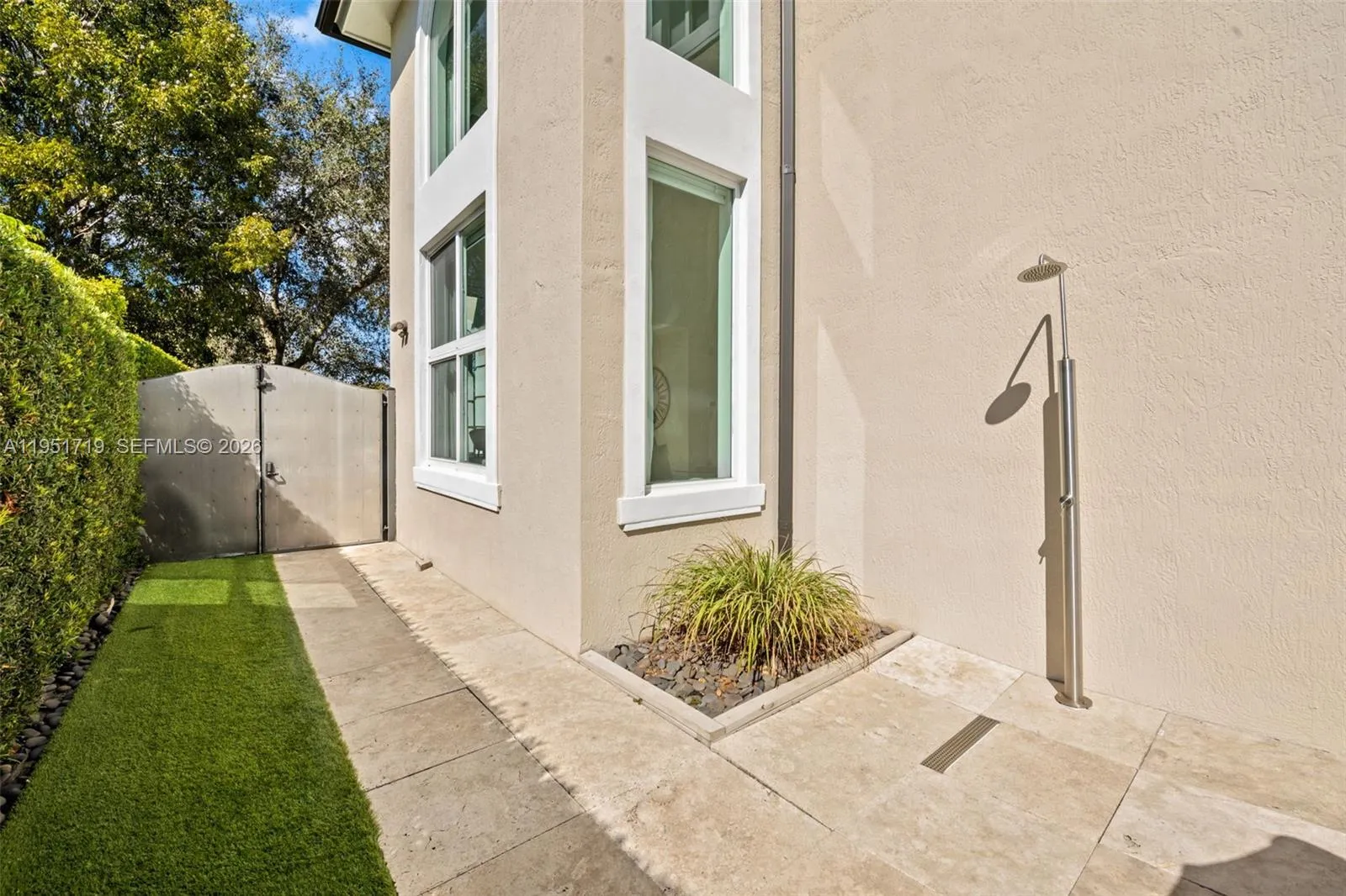 A direct top-down view emphasizes the generous lot size, professional landscaping, and the integrated layout of the home and outdoor living spaces.