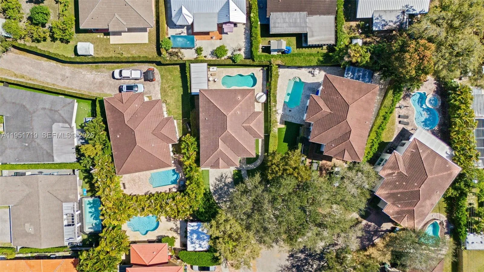 A vibrant recreation space equipped with foosball, billiards, and comfortable contemporary seating, all set against high-gloss blue flooring.