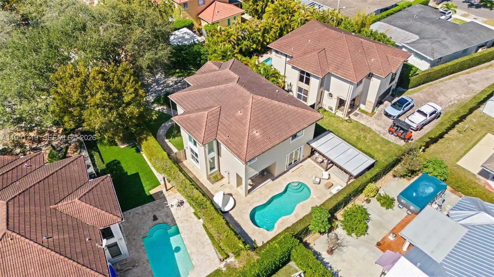 The modern entrance foyer features striking blue epoxy flooring, textured stone wall accents, and an open layout leading into the fitness facilities.