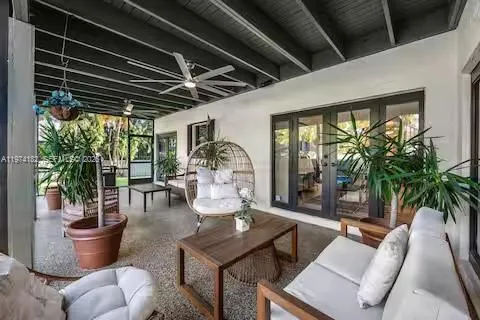Covered outdoor living with hanging bubble chair!