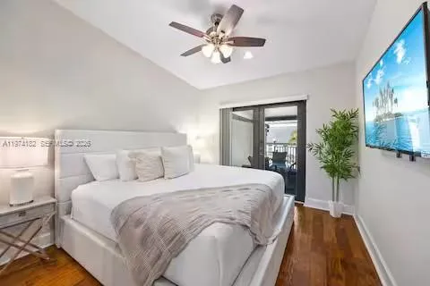 White bedroom bliss with private balcony access!