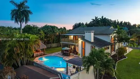 Contemporary tropical estate glowing at golden hour!