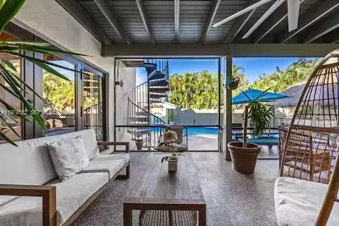 Industrial-chic covered patio with pool views!