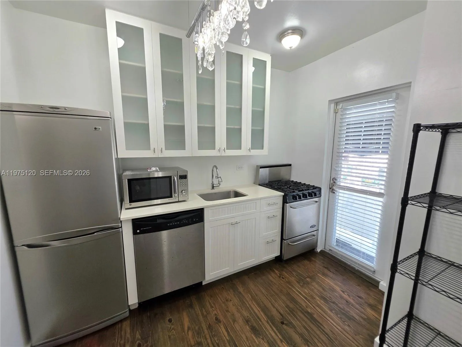 Nicely updated kitchen with second exit to balcony leading to stairs (North Exit from Apt). Gas stove/range