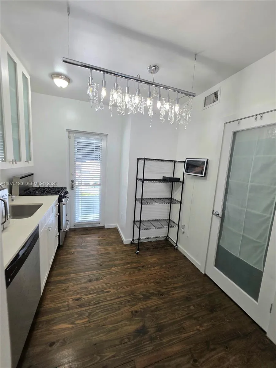 Nicely updated kitchen with second exit to balcony leading to stairs (North Exit from Apt)