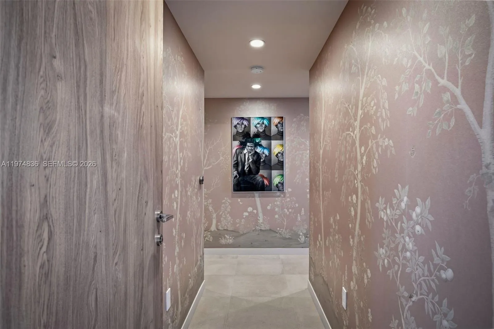 Beautifully finished private primary suite with hallway to two large walk in closets and an oversized bath with dual sinks, a large marble shower and Roman tub.