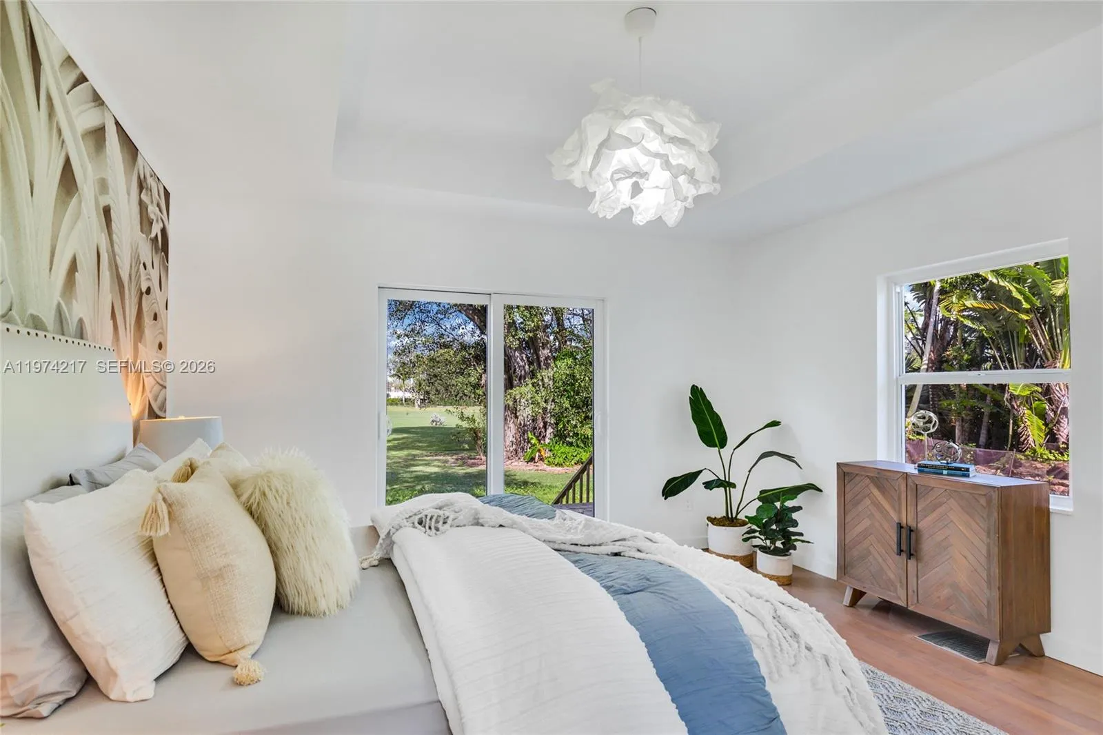 second bedroom with pool and golf views
