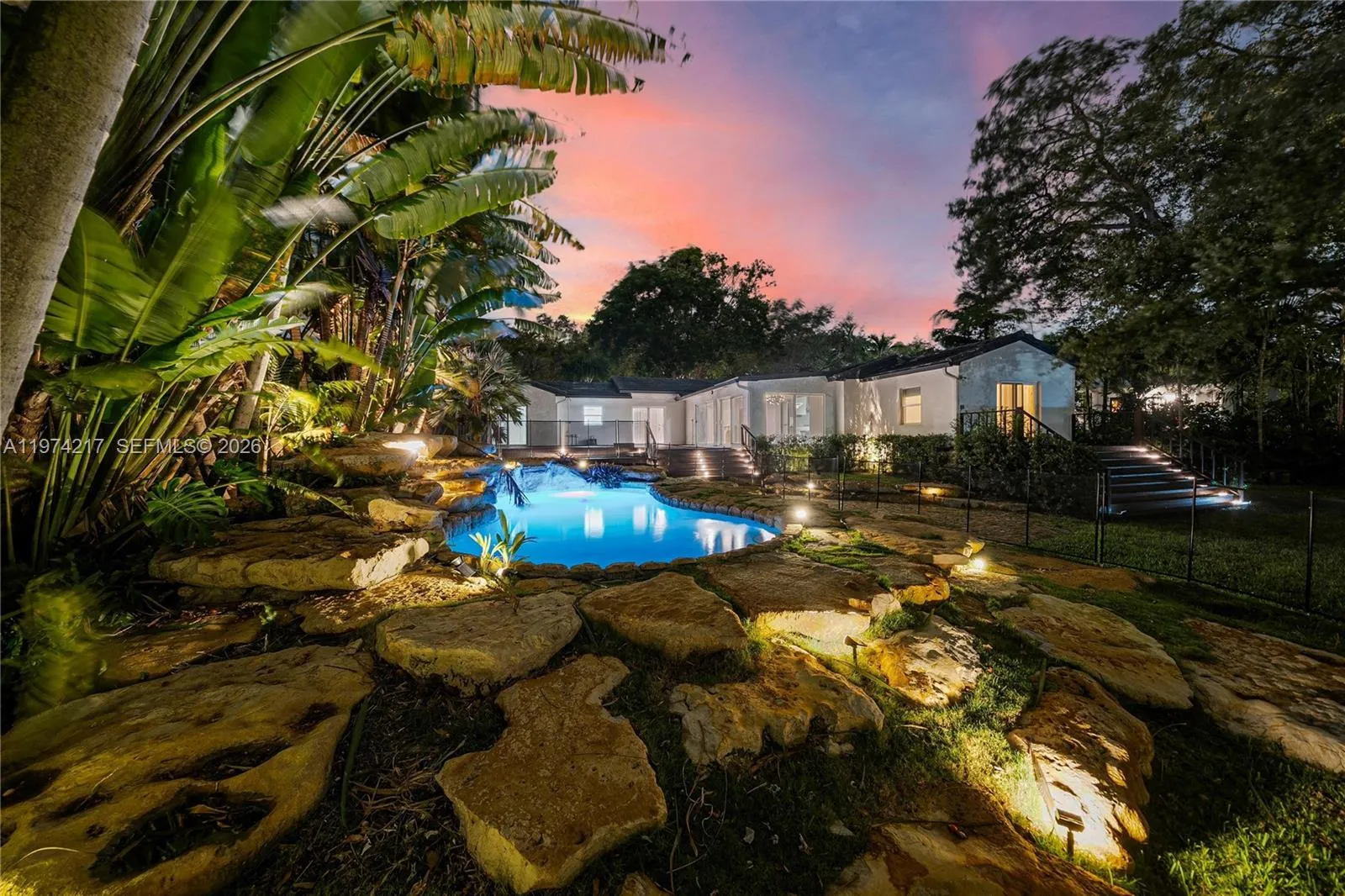 Lagoon style pool with rock accents