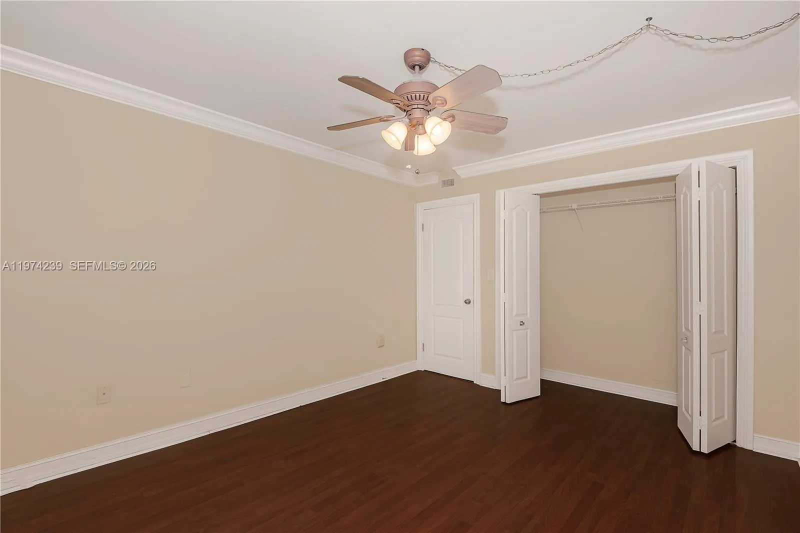 2nd Bedroom with open closet and closed entry door