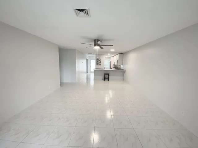 Living room to dining area to kitchen