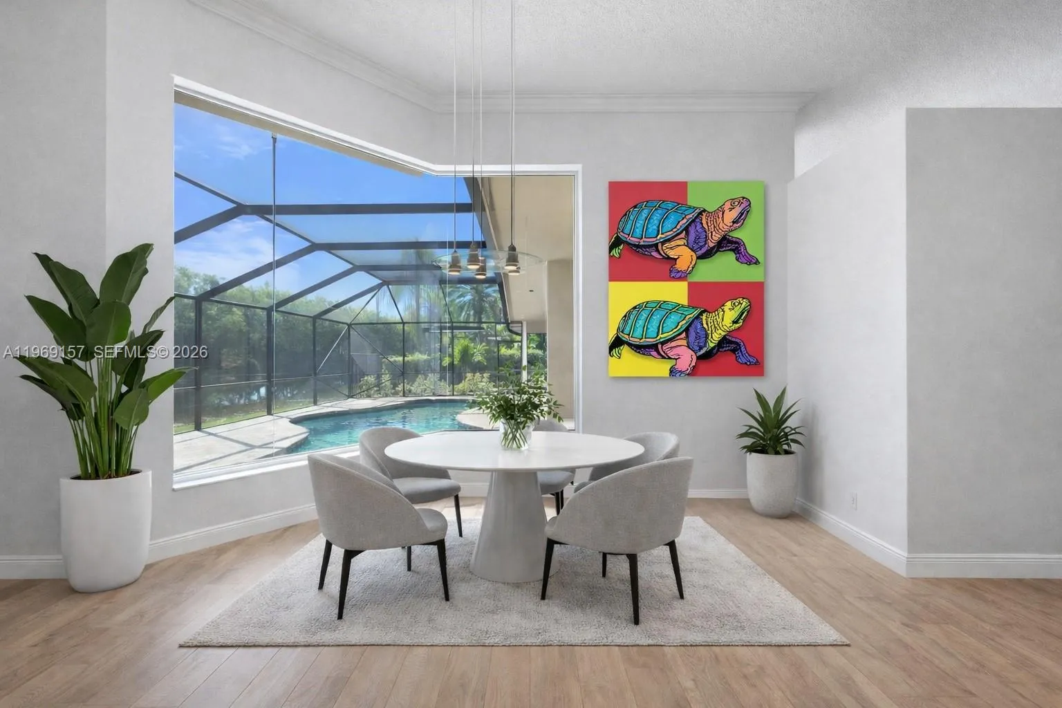 DIGITALLY ENHANCED & STAGED to show how the Breakfast nook with white walls and neutral flooring