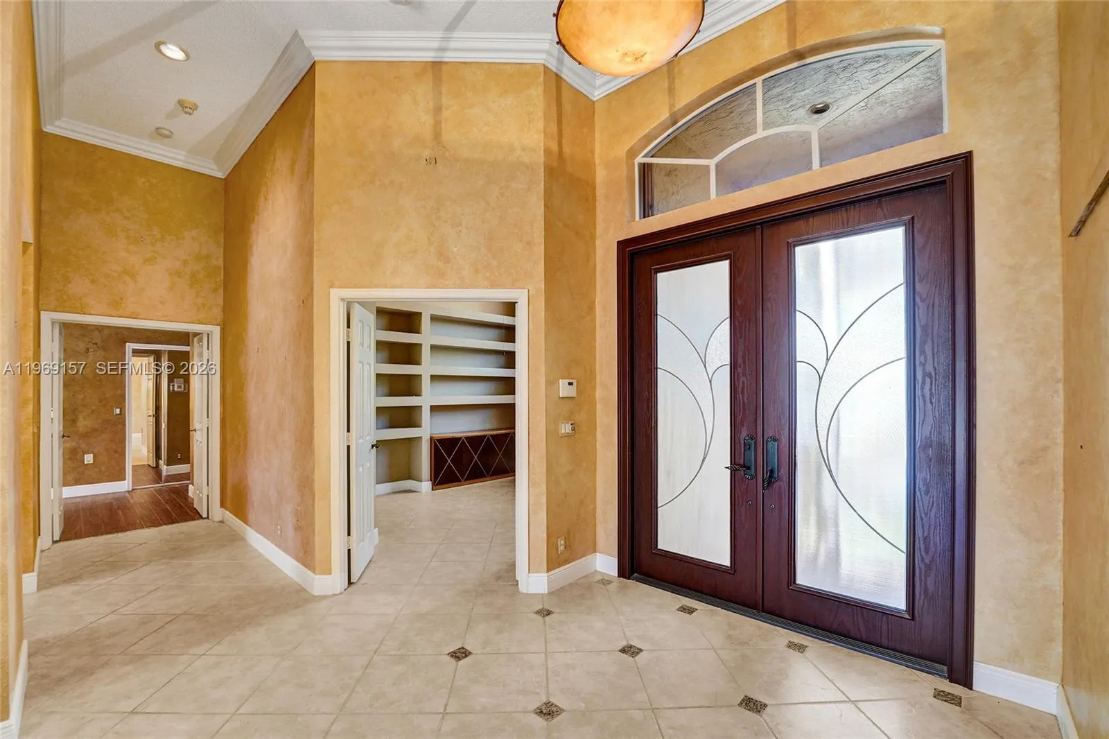 Entry door with the bedroom/office space immediately to the right and hallway into master bedroom/bathroom