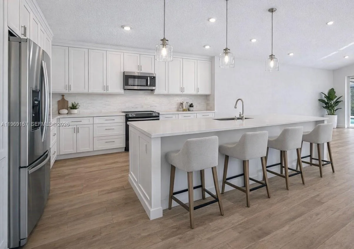 DIGITALLY ENHANCED to show how the kitchen can look with an island, white walls and neutral flooring
