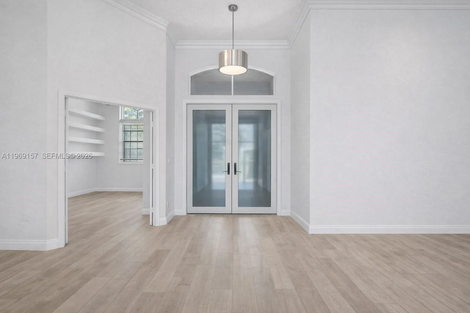 DIGITALLY ENHANCED to show same view with white walls, neutral flooring & new doors