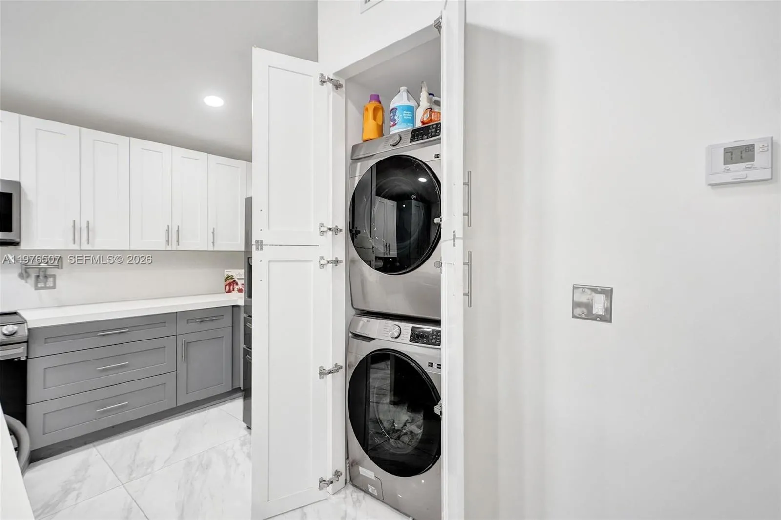 CONVENIENT LAUNDRY SPACE RIGHT OFF OF THE KITCHEN!