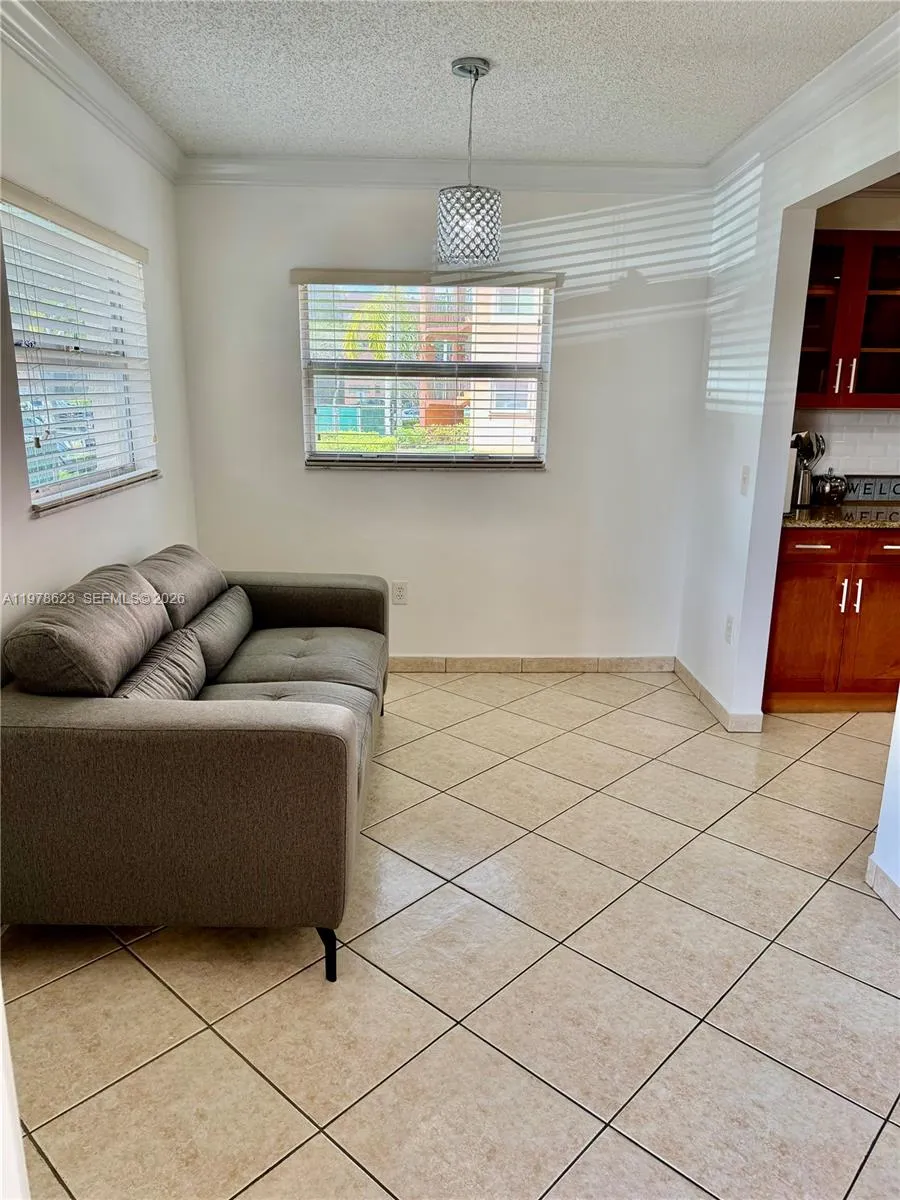 CORNER NOOK OFF OF ENTRANCE & KITCHEN-MANY WAYS TO USE THIS BONUS NOOK WITH 2 WINDOWS