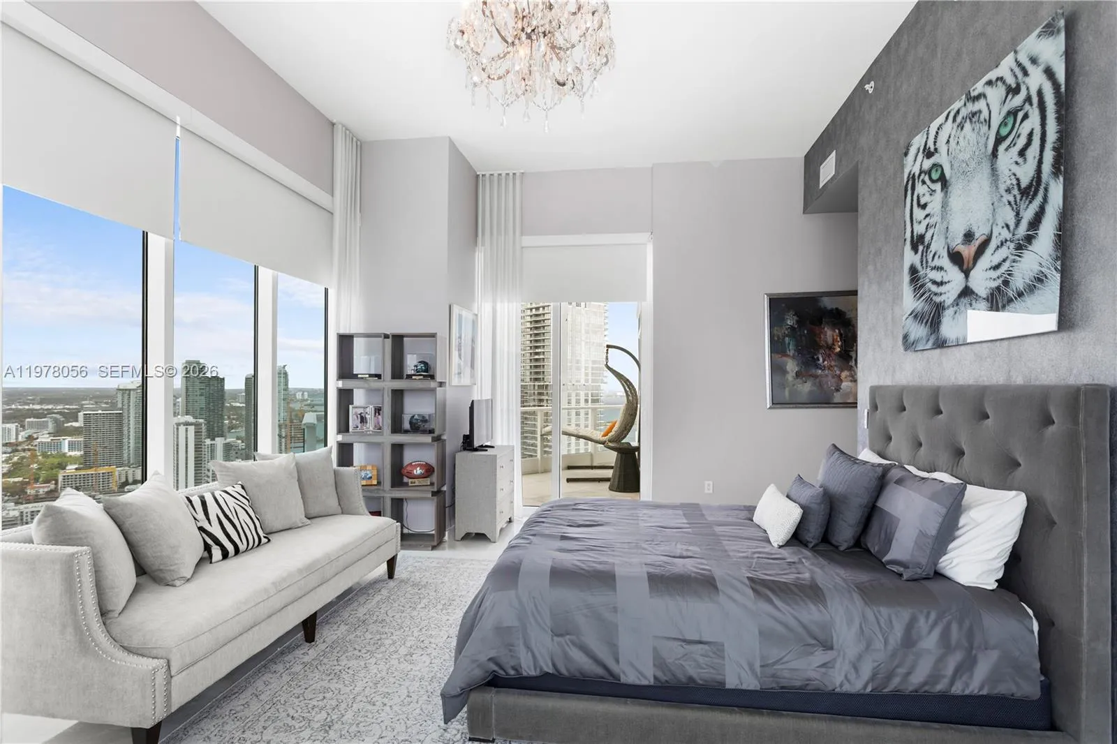 Bedroom with sitting area and skyline views. West and North Views