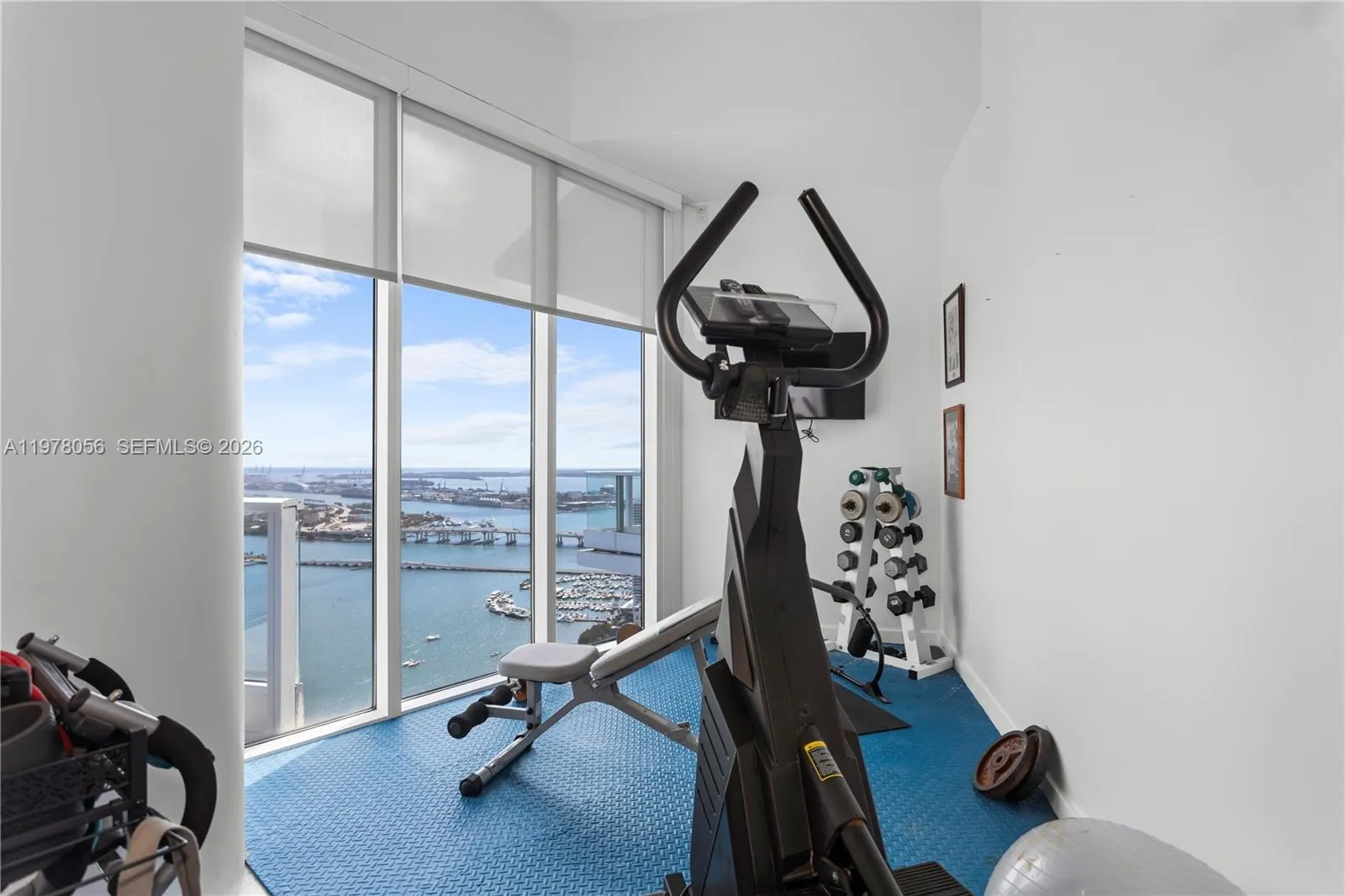 Home fitness or office room with spectacular water views